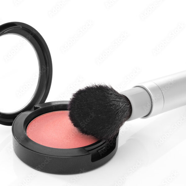 Pink blush and makeup brush on white background